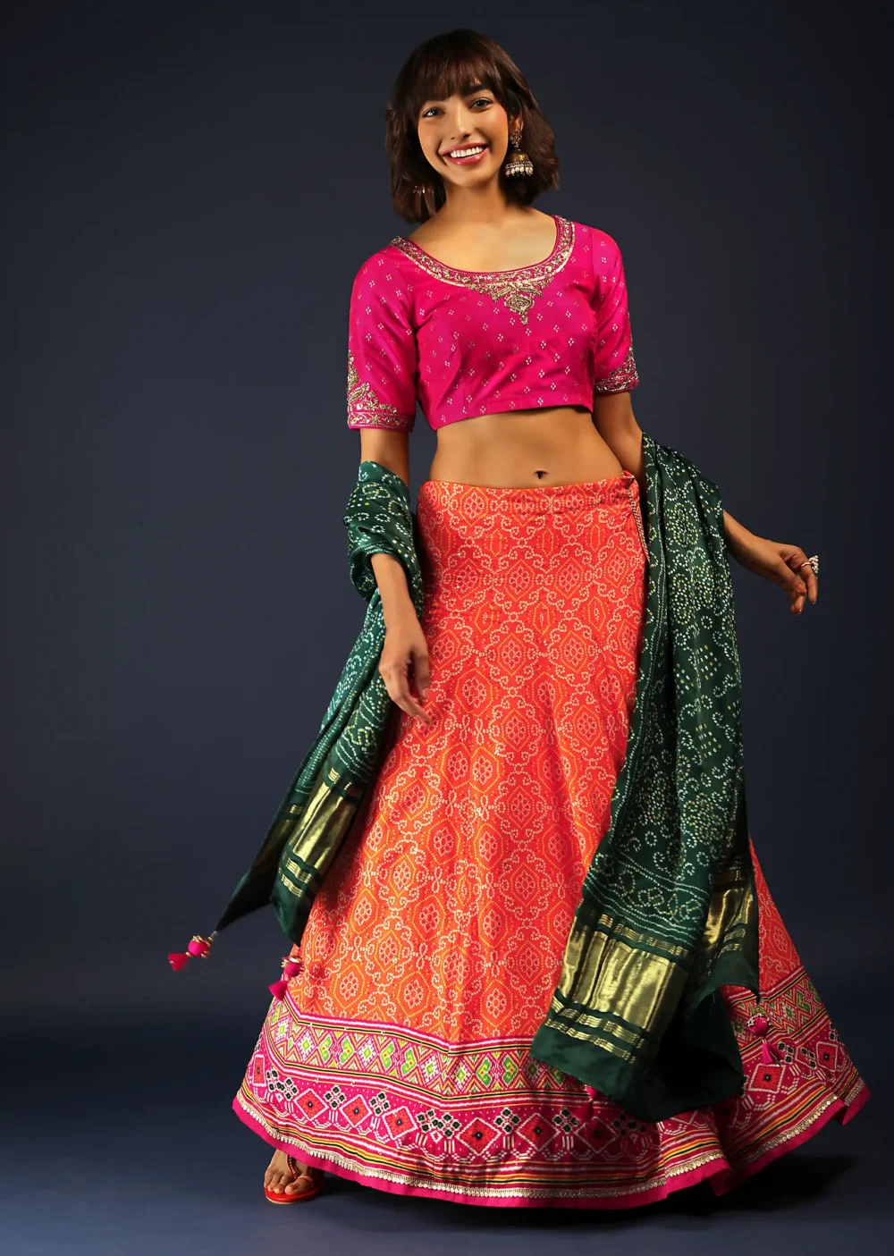 Tangerine Orange Lehenga In Bandhani Printed Silk With Rani Pink Choli And Green Bandhani Dupatta