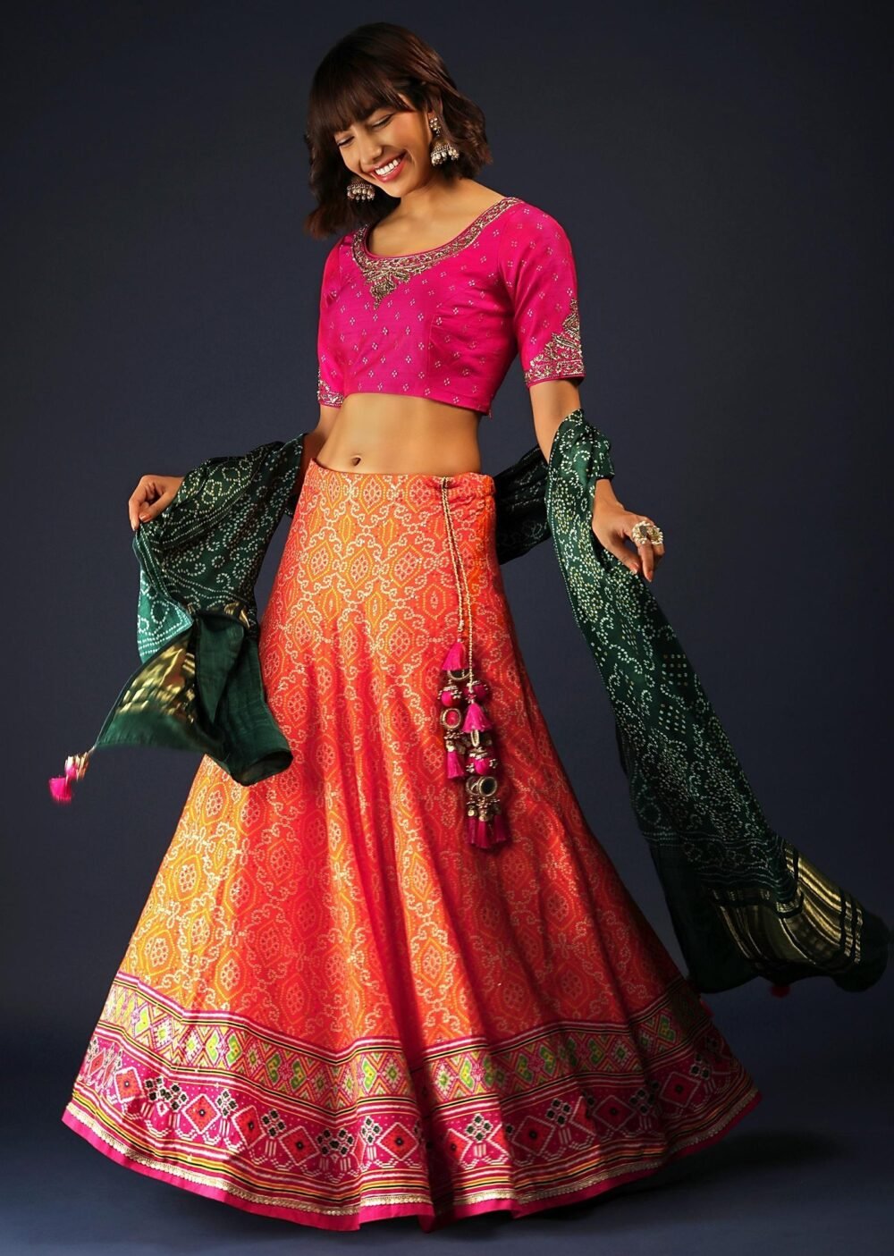 Tangerine Orange Lehenga In Bandhani Printed Silk With Rani Pink Choli And Green Bandhani Dupatta - Image 2